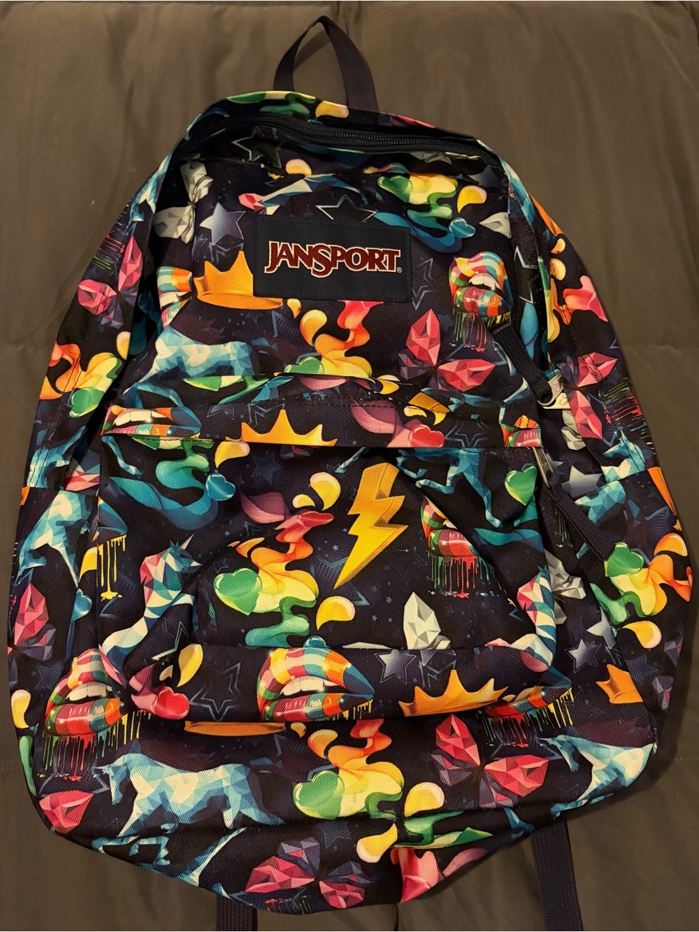 Jansport Black Multicolor Graphic Backpack with Lightning Bolt Motif.